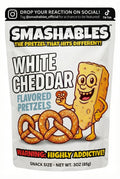 Packaging of Smashables White Cheddar flavored pretzels with a cartoon pretzel character on a white background.